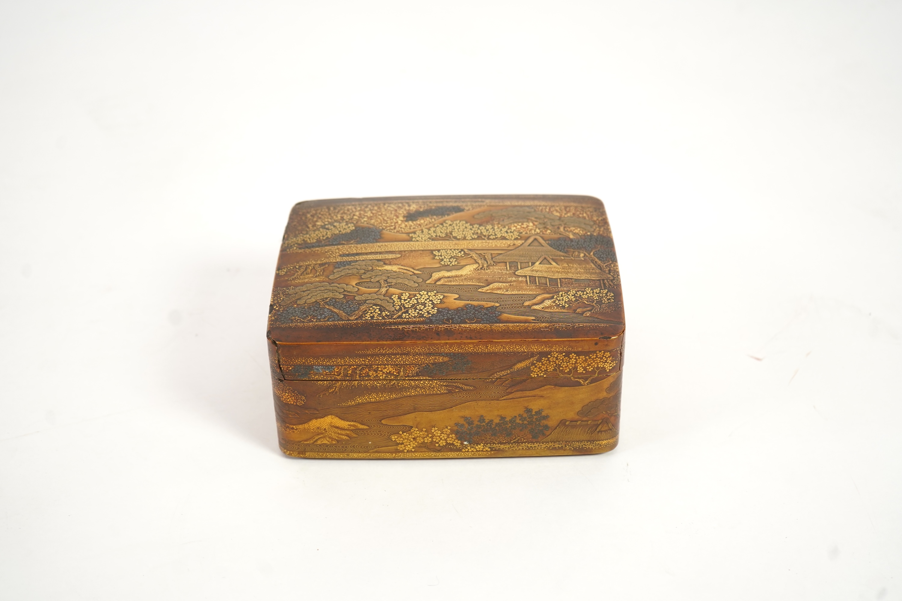 A Japanese gold lacquer ‘landscape’ box, tray and cover, 19th century
